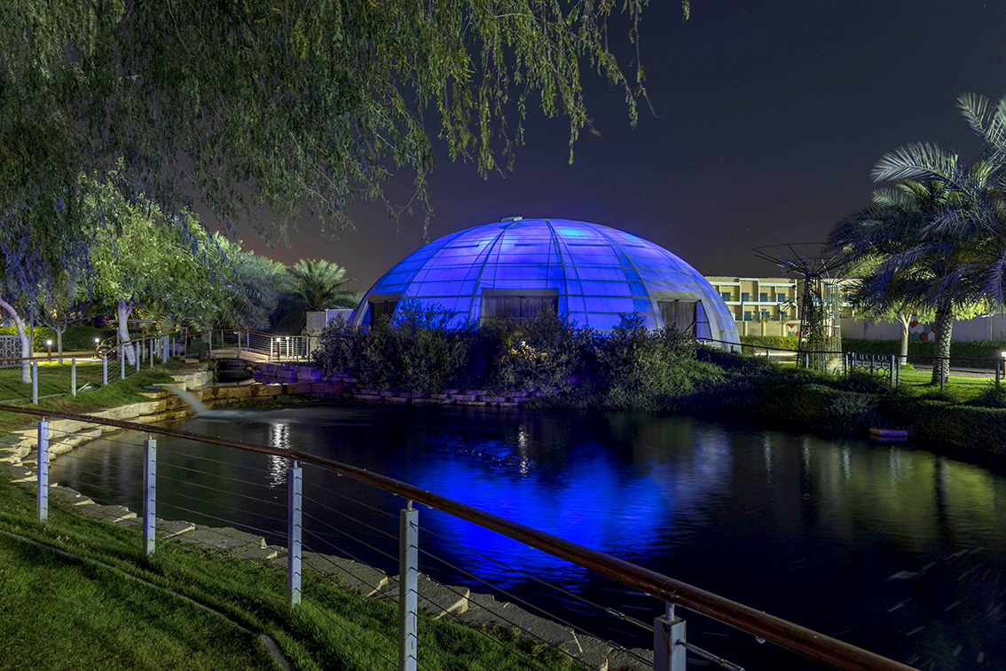 The Sustainable City lights up its green biodomes blue to mark Autism Awareness Month